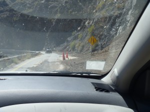 Recent slide into the road not yet cleared because a crew is working on the others farther along.