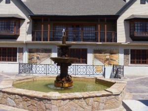 Entrance to the wine shop is down the stairs past the murals.