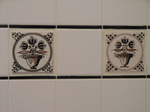 18th century tiles I bought in Delft the year we moved in to the house. I love the differences you can see even though they were both made from the same design template.